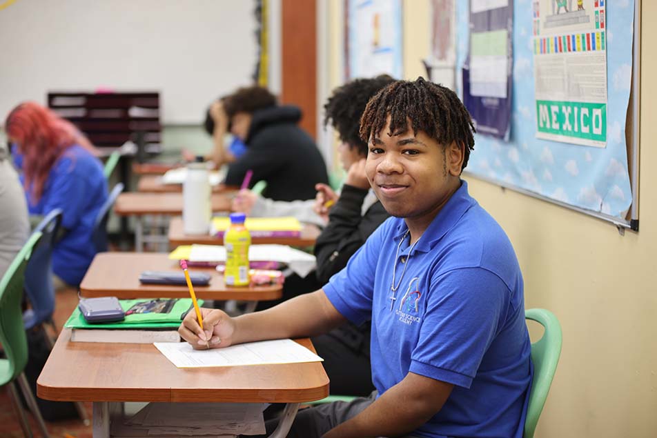 students and teacher working in classroom