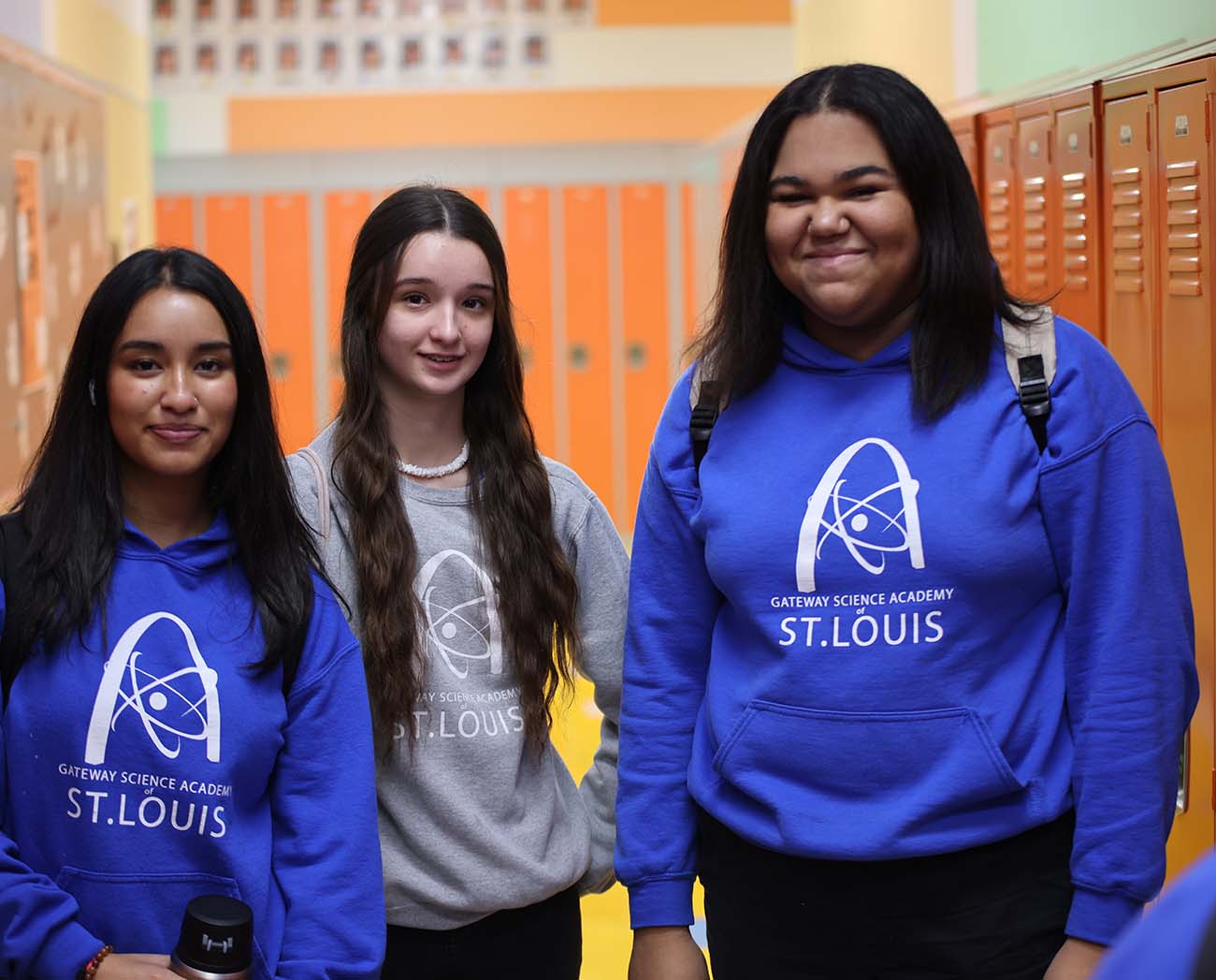 Smiling children together outdoors.